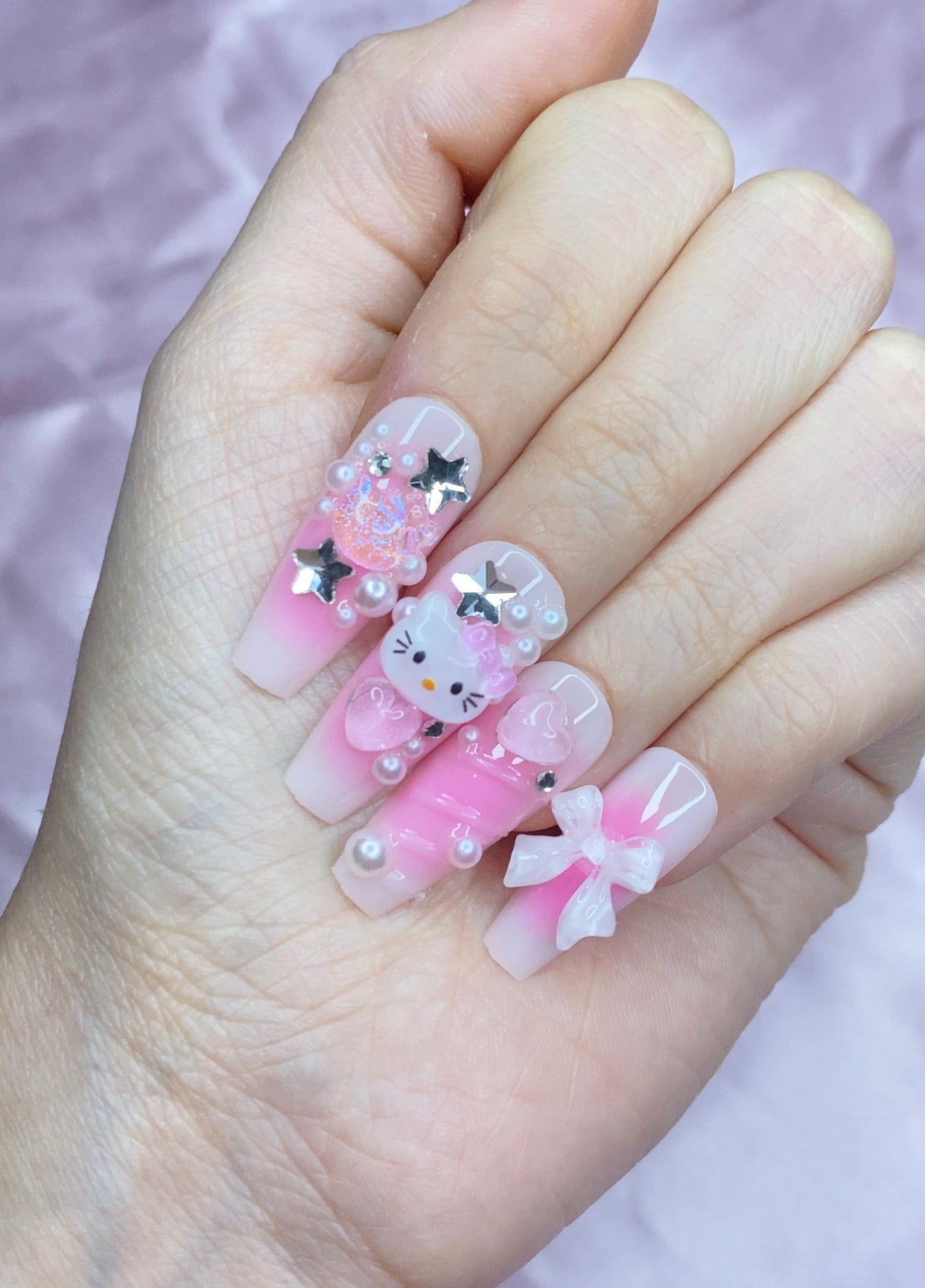 Pink airbrush hello kitty nails